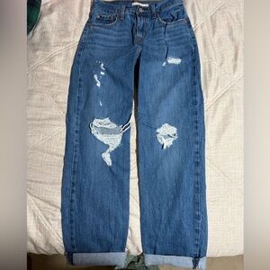 Blue ripped Levi Jeans